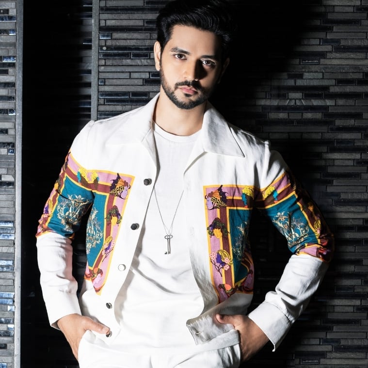 Shakti Arora in multicolor jacket and white inner posing for camera - most handsome tv actor Indian all the time