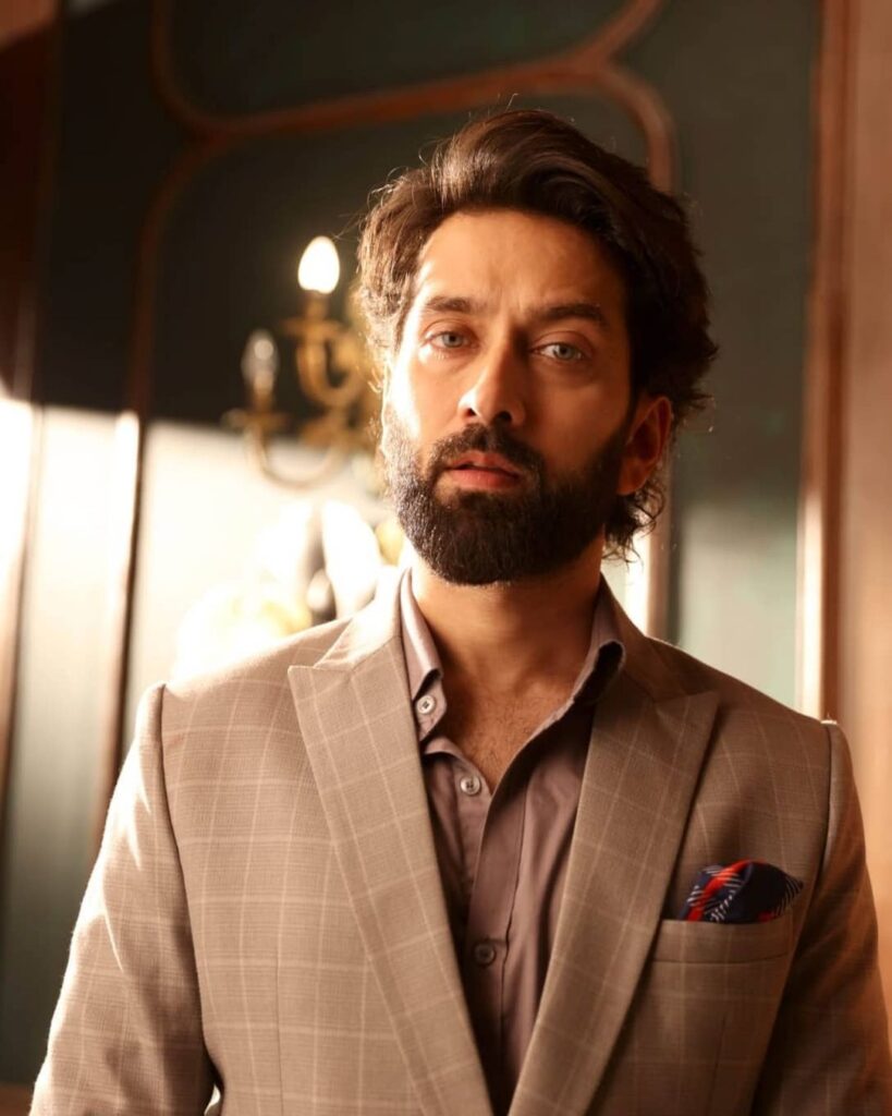 Nakuul Mehta wearing suit and posing for camera - most handsome tv actors indian 2021