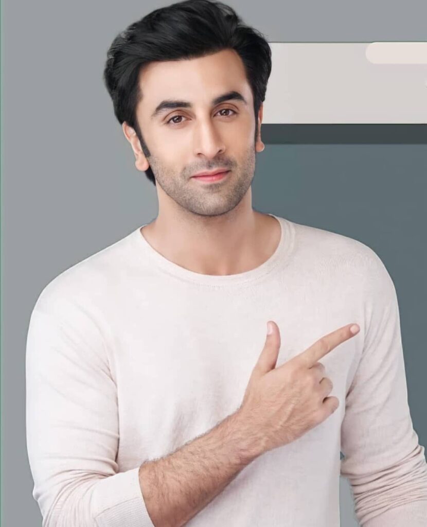 Smiling Ranbir kapoor posing for camera in white t-shirt - most handsome bollywood actor