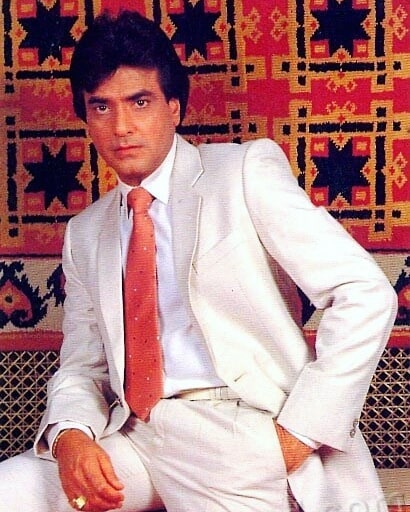 Jeetendra in white suit with red tie posing for camera - handsome man in India 2021