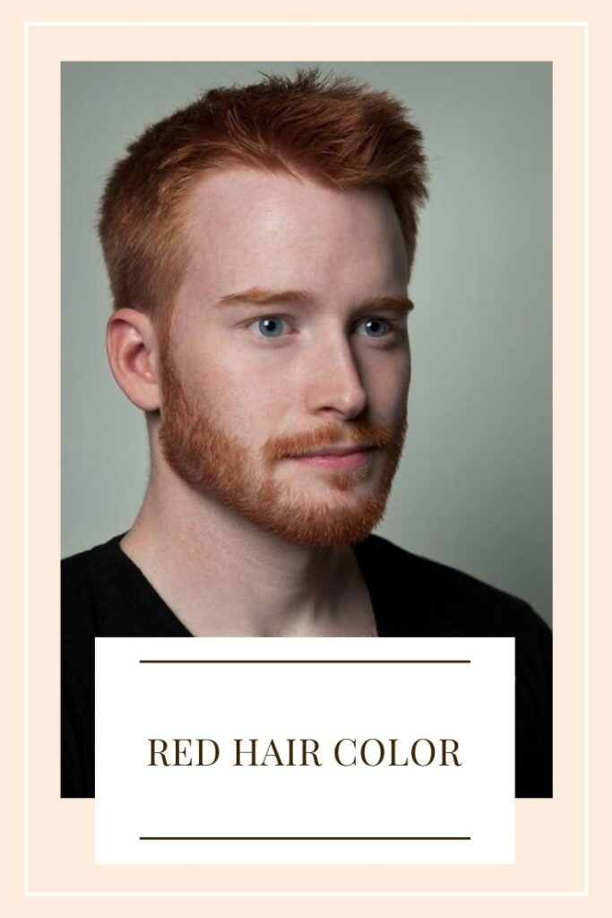 A boy in black t-shirt showing his red hair A boy in black t-shirt showing his red hair - trending hair color for men