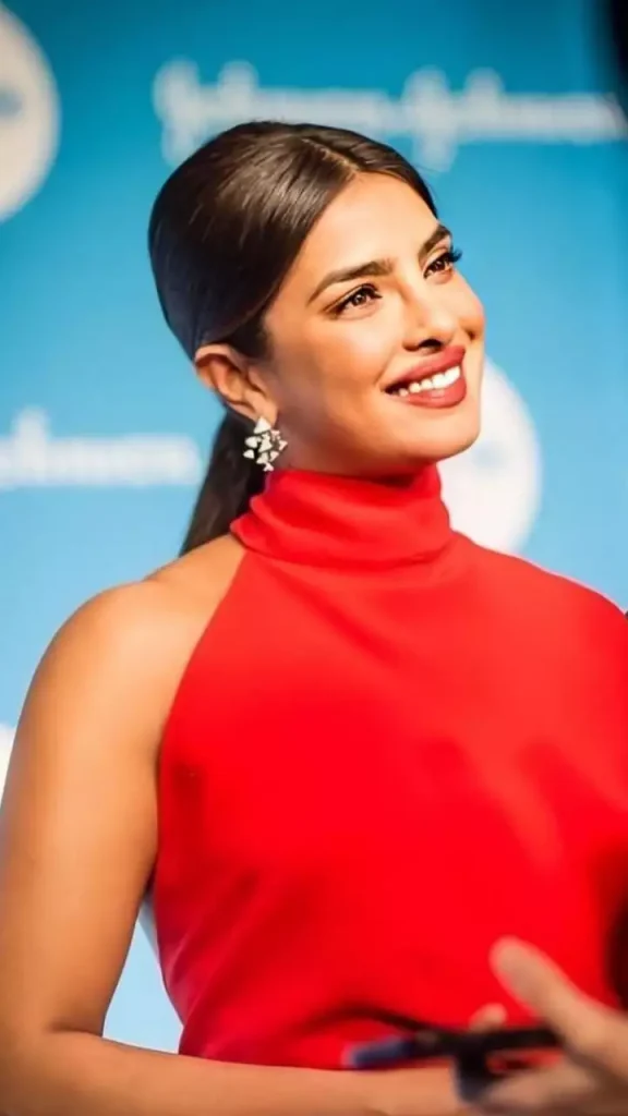 Priynaka Chopra in red top with sleek and shiny ponytail - priynaka chopra hairstyles