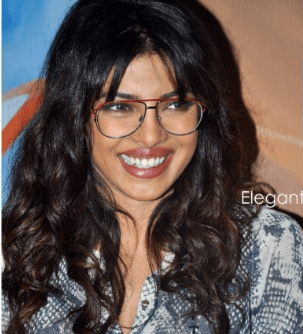 Smiling Priyanka Chopra in Spectacles showing her messy hairstyles -  Priyanka Chopra Hairstyles