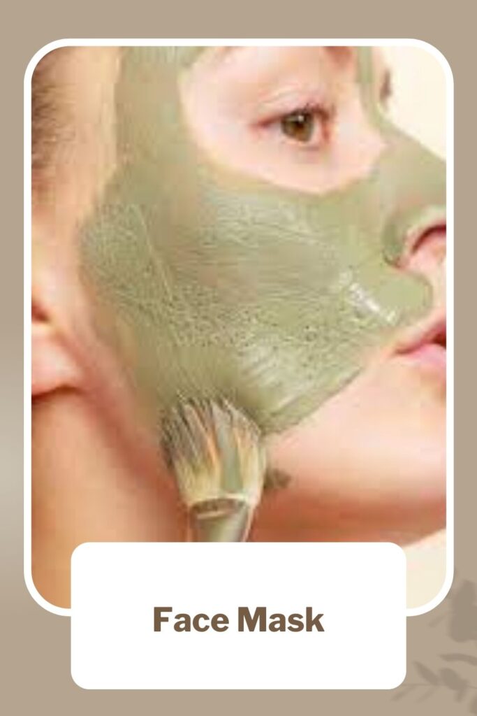 a girl is applying face mask with a brush - skin care routine for acne prone skin