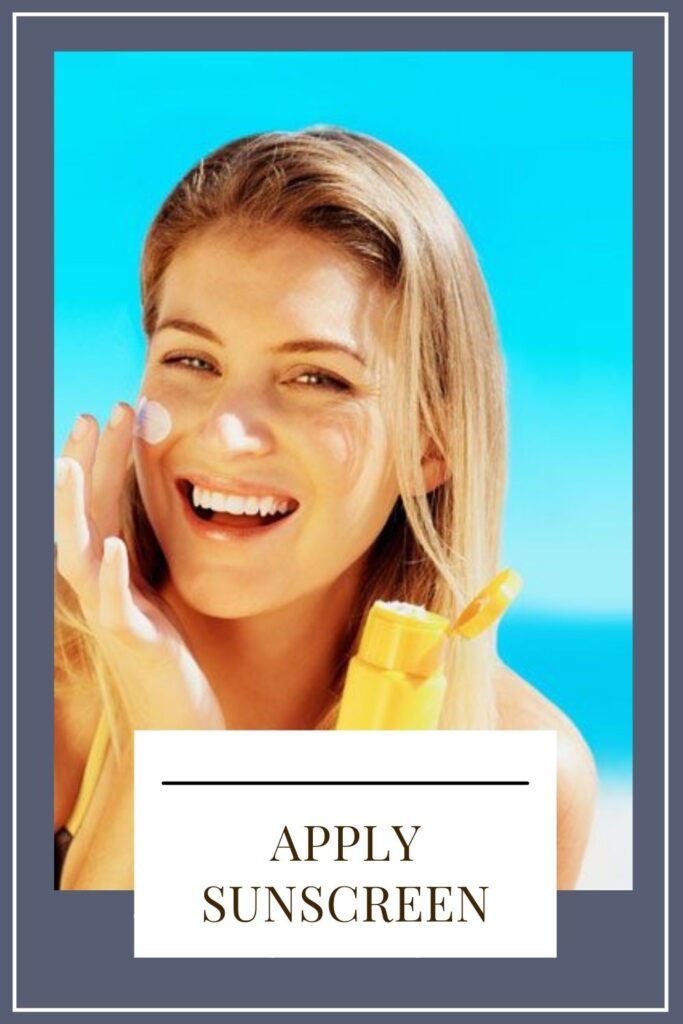 A smiling girl is applying sunscreen on her cheeks A smiling girl is applying sunscreen on her cheeks - skin care tips natural