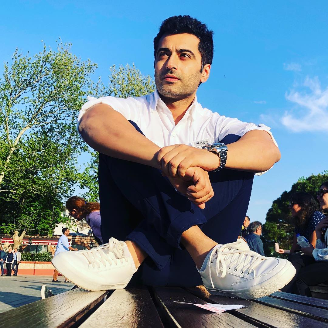 Harshad Arora in white shirt, blue pant and white sneakers posing for camera - Models in India