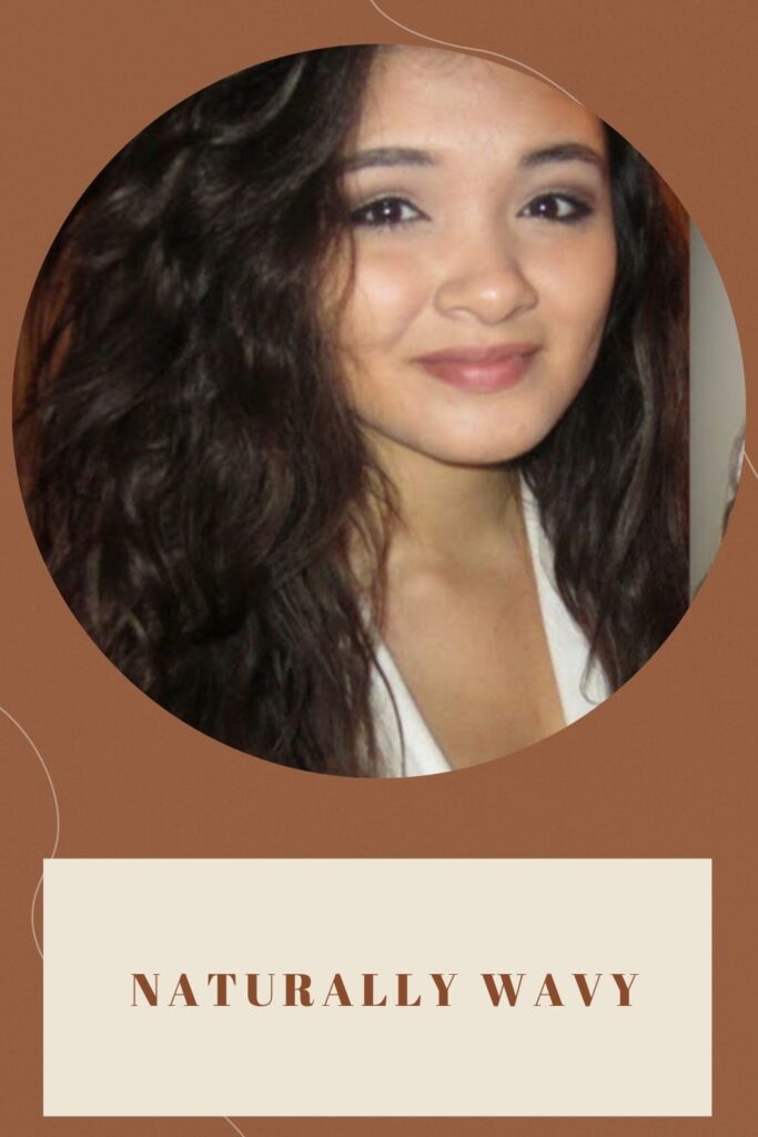 A smiling girl is showing her naturally Wavy hair A smiling girl is showing her naturally Wavy hair - medium haircuts for round faces