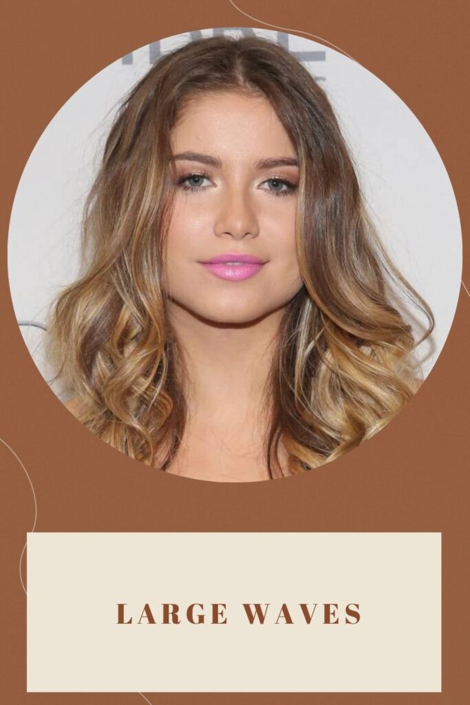 A smiling girl wearing purple lipstick and showing her Large Waves hairstyle A smiling girl wearing purple lipstick and showing her Large Waves hairstyle - hairstyles for round face