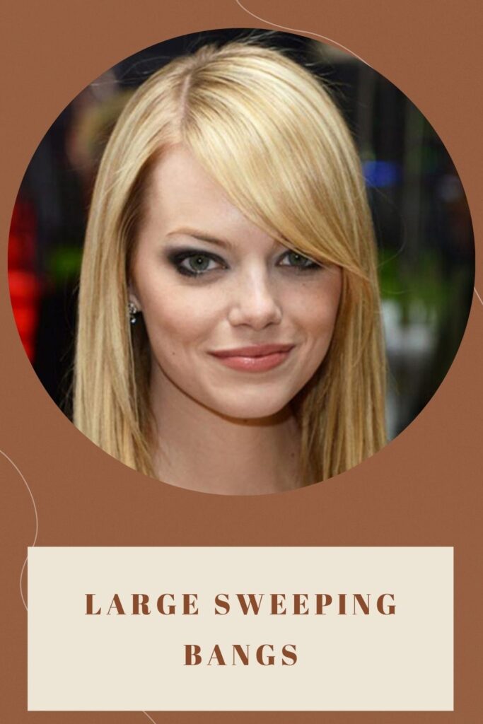 A girl with blonde hair showing her Large Sweeping Bangs A girl with blonde hair showing her Large Sweeping Bangs - haircuts for round faces 2022