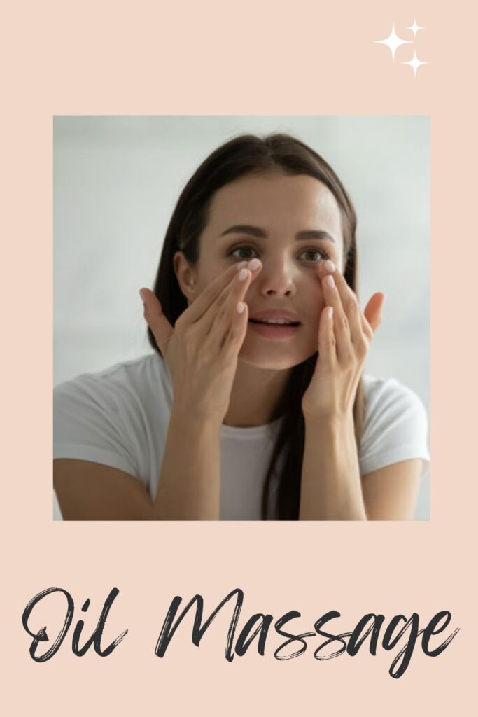A lady in  white t-shirt giving Oil Massage to her under eye area - dark circles