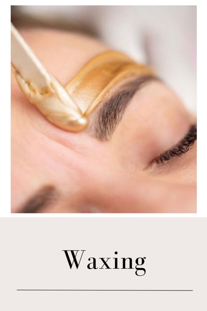 A lady is setting her eyebrows with the help of waxing - glowing skin