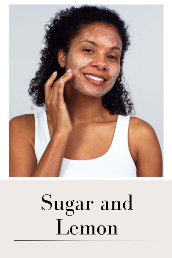 A girl in white tank top applying Sugar and lemon face mask with her finger tips - facial hair in women