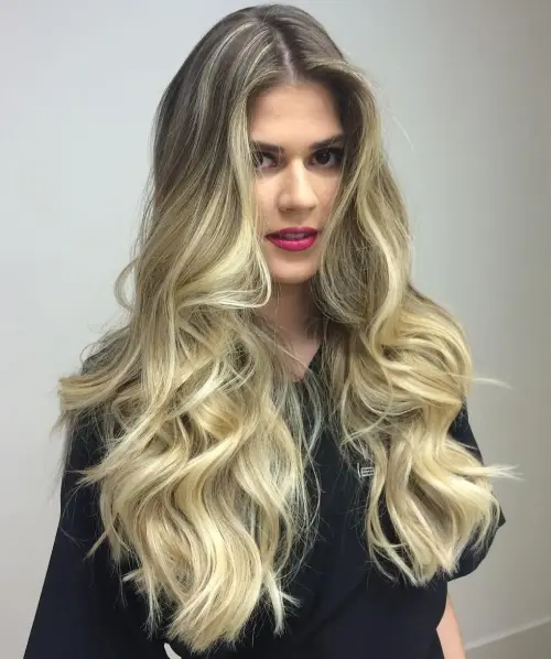 A girl in black top showing her Platinum Long Layered Hair - hairstyles for long hair