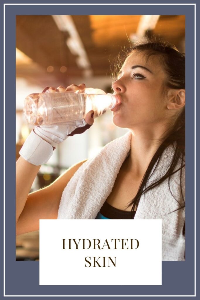 A girl is drinking water with bottle A girl is drinking water with bottle - Working Out Affects