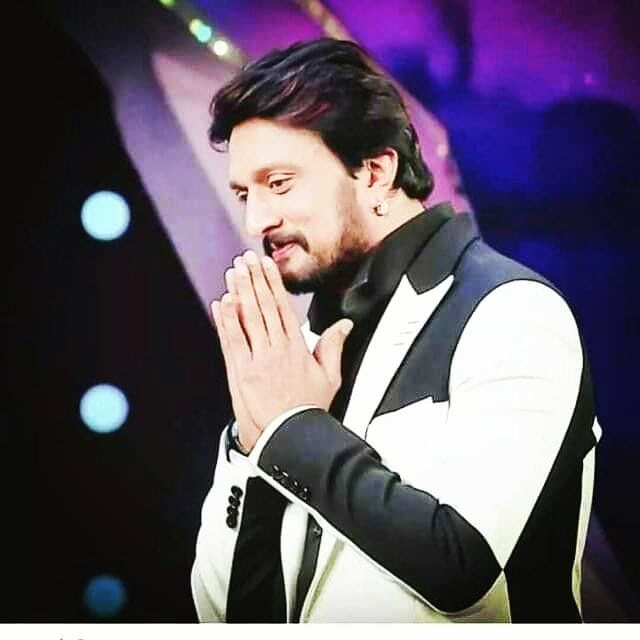 Kiccha Sudeep in black and white suit posing for camera - handsome south indian actors