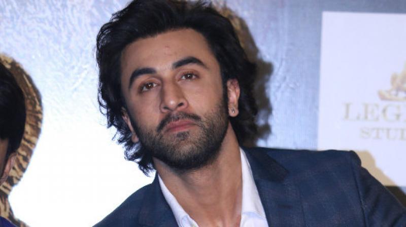 Rabir Kapoor in Blue coat with white shirt showing off his cool long hairstyle - ranbir kapoor latest hairstyle