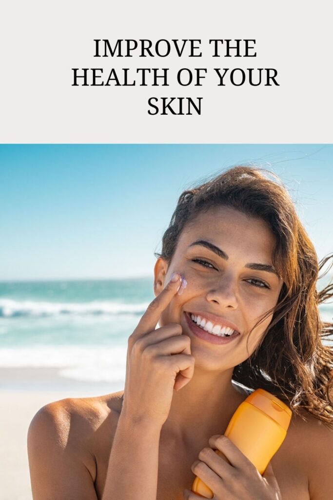 A smiling girl is applying sunscreen on her face - Glowing And Protected Skin