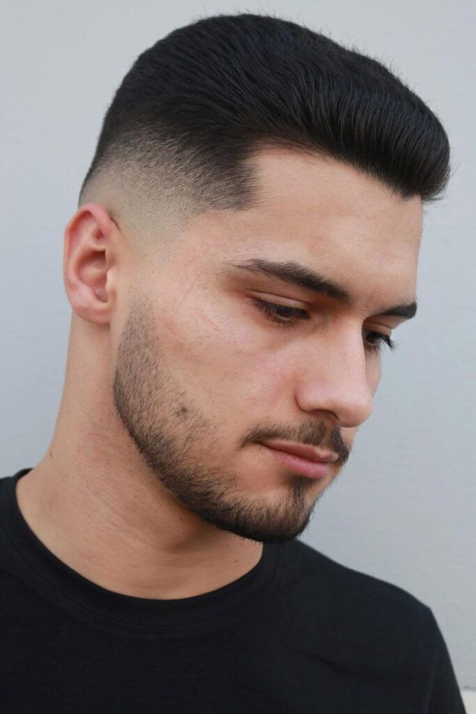 A man in black round neck t-shirt showing his Tousled Undercut - haircut for men
