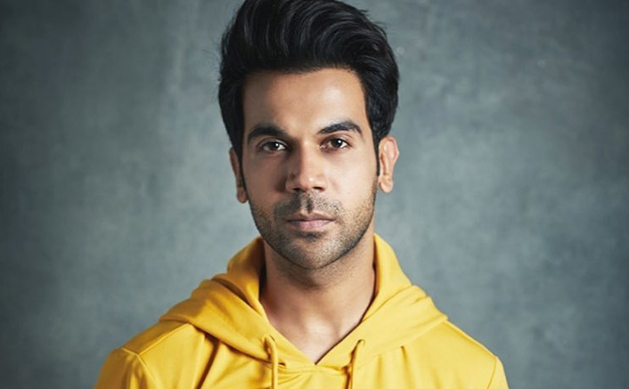 Rajkumar Rao in yellow hoodie posing for camera and showing his tousled hairstyle - bollywood actors latest hairstyle