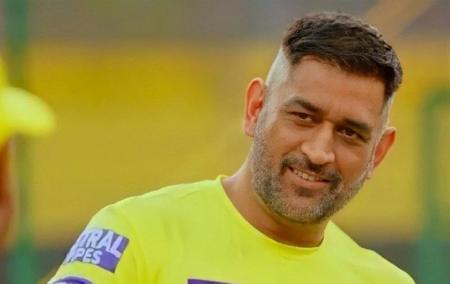 MS Dhoni in Channai Super Kings Uniform smiling and showing his French Crop hairstyle - MS Dhoni hairstyle IPL 2022