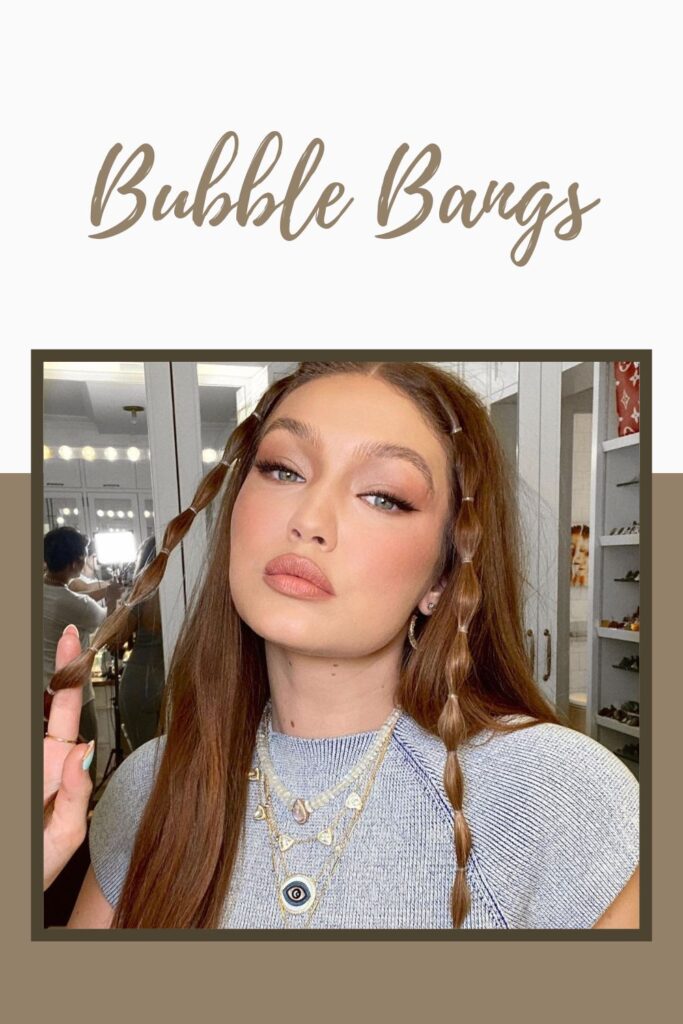 Açık mavi bluzlu bir kız kameraya poz veriyor ve Bubble Bangs saç modelini gösteriyor - kızlar için trend olan saç modeli