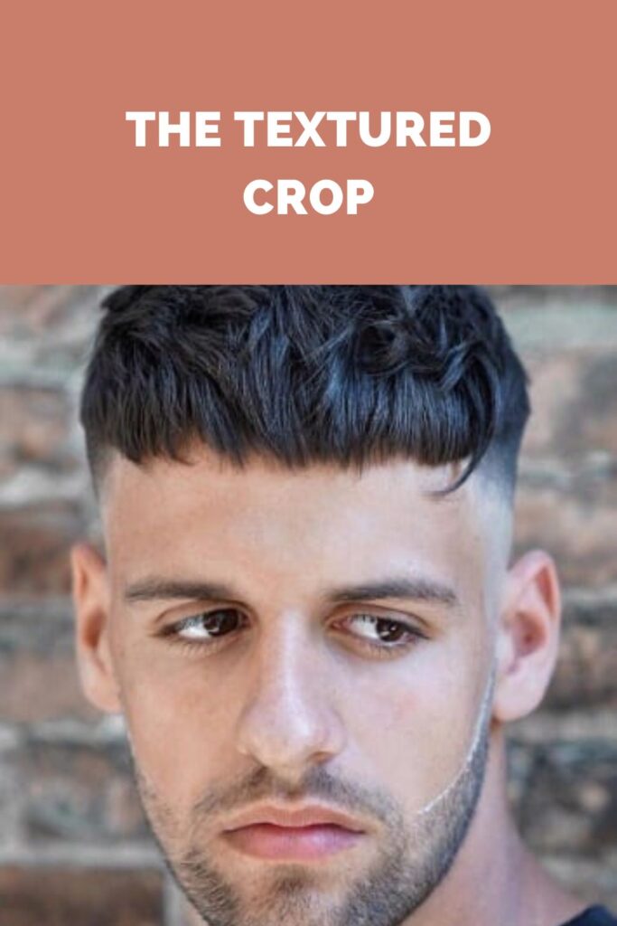 A boy posing for camera and showing his textured crop - men hairstyles 2022