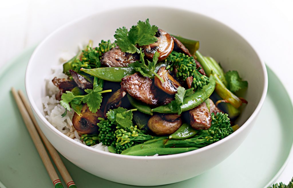 Flat Iron Steak with Shallots and Broccolini serving in a white bowl - dinner ideas for bodybuilders