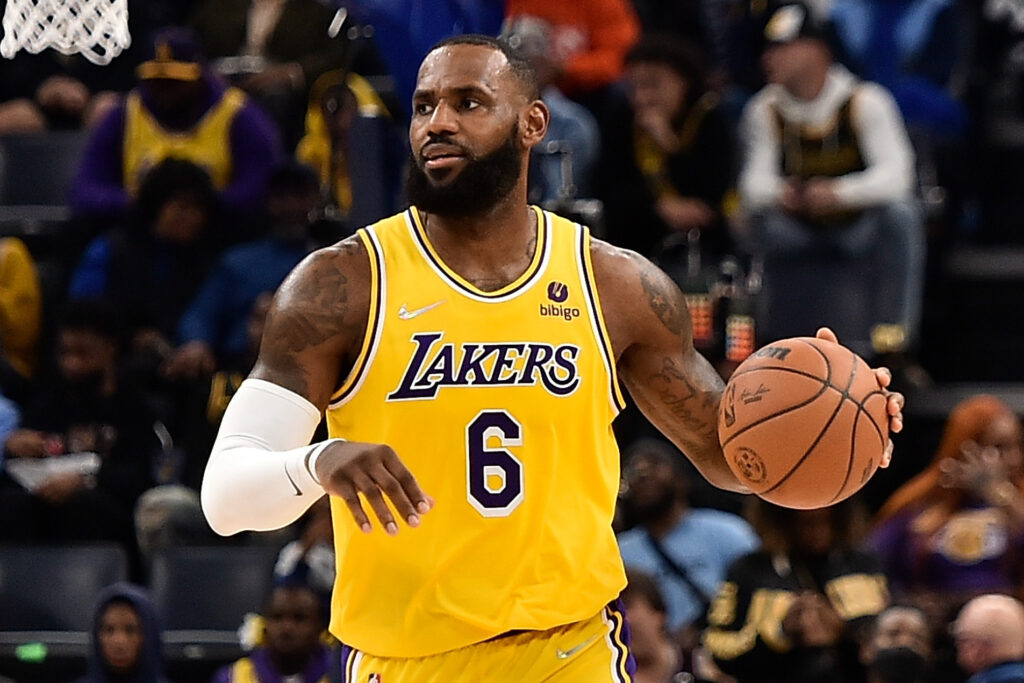 LeBron James in team dress with ball in his hands - indian celebrities who have done lasik