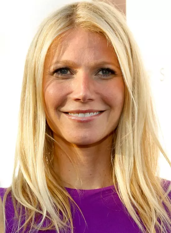 Smiling Gwyneth Paltrow in purple dress posing for camera and showing her ultra-smooth hair - celebrity hairstyles 2022