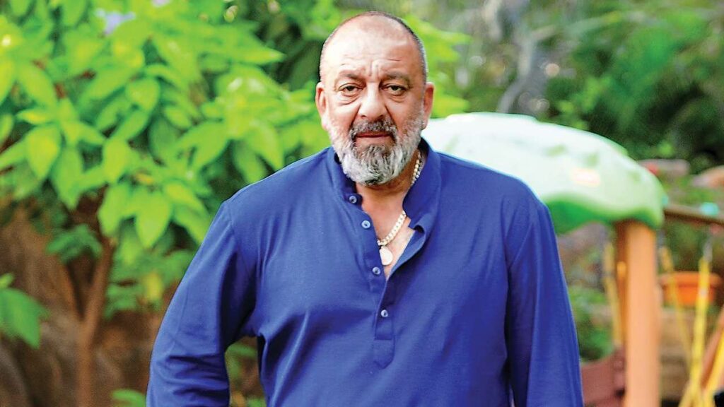 SanJay Dutt in blue shirt posing for camera - indian actors without makeup
