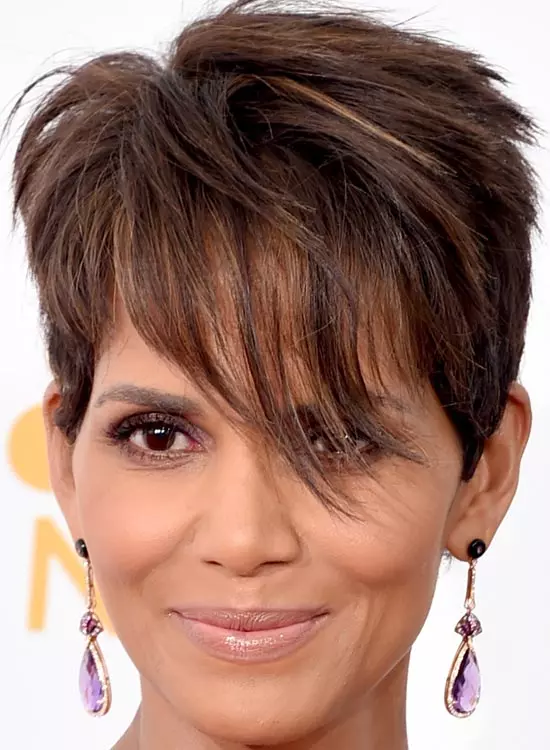 Smiling Halle Berry in purple danglers posing for camera and showing her Layered Pixie hairstyle - actresses hairstyles