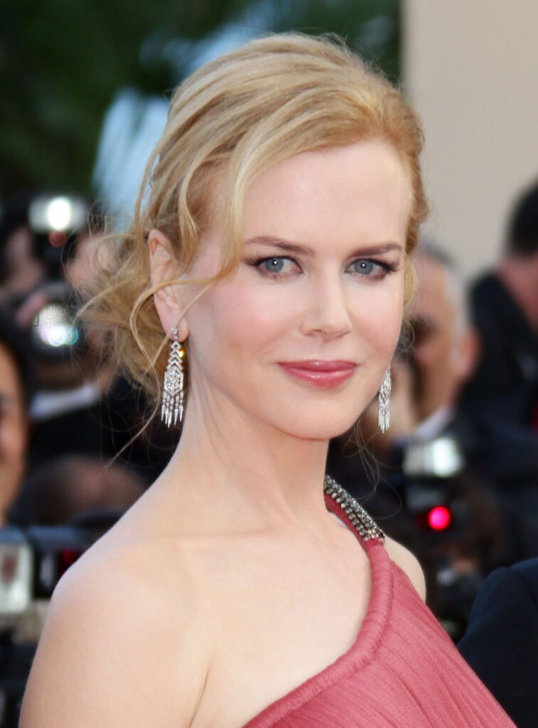 Nicole Kidman in one shoulder pink dress with matching drop earrings and matching lipstick - Famous people with lasik