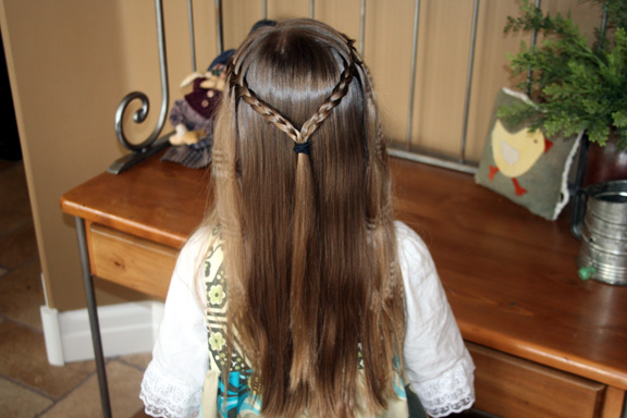 A girl in white dress showing the back view of her Double braid with crimp hairstyle - hairstyle for teenage girls