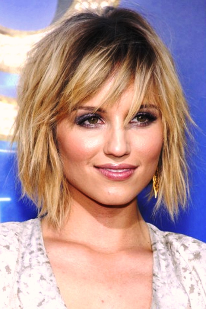 A girl in printed dress showing her Jagged Crop hairstyle - short hairstyle for girls 2022