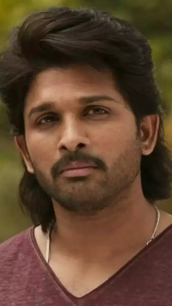Allu Arjun in brown V-neck t shirt posing for camera and showing his Long Waves hairstyle - Allu Arjun hairstyle Surya