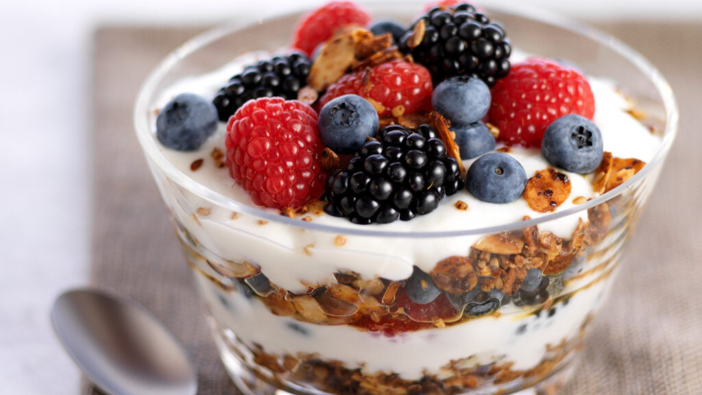 Yogurt Parfait with Wheat Germ and Berries served in a glass - breakfast for a body builder