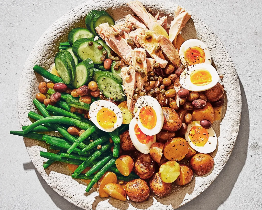Lots of vegetables and eggs are served in a bowl - die for bodybuilding