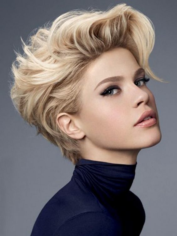 A girl in blue high neck top showing the side view of her Crazy Volume hairstyle - short haircuts for teenage girls