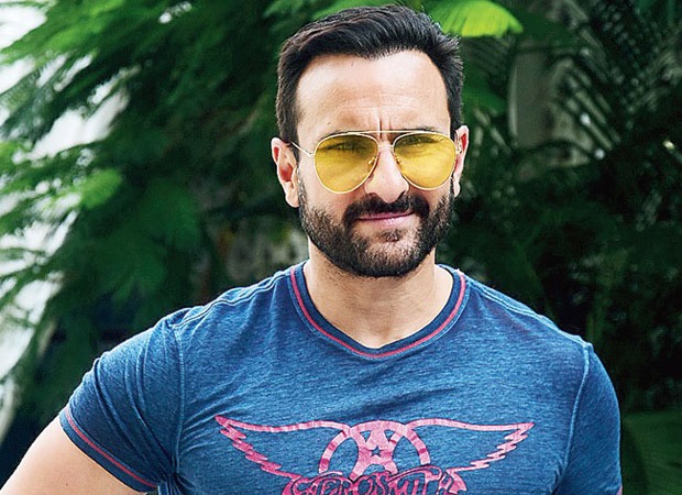 Saif Ali Khan in blue printed t-shirt and goggles posing for camera - Indian actors hairstyles 2022