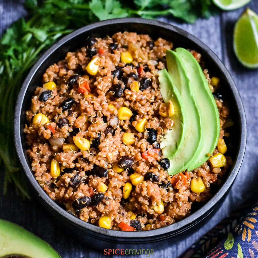 One pan Mexican Quinoa serves in a black bowl - great bodybuilding meals