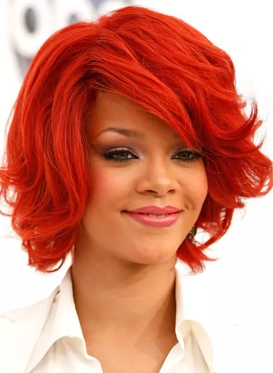 Smiling Rihanna in white shirt and red Short Bob hairstyle - celebrity hairstyles 2022