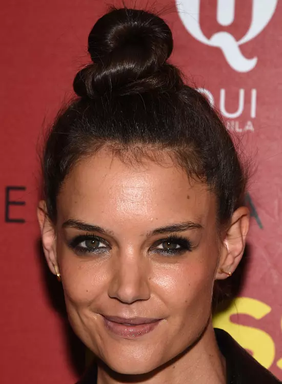 Smiling Katie Holmes in bold eye makeup with Top Knot Bun - Best Hollywood hairstyles
