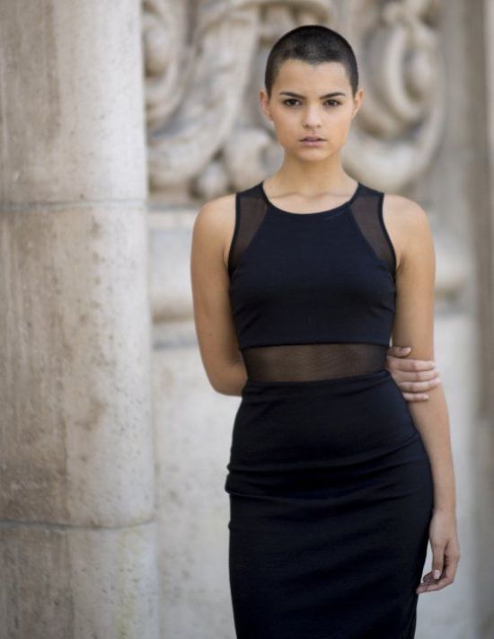 A girl in black cut sleeves long dress showing her buzz cut - hairstyle for girls for school
