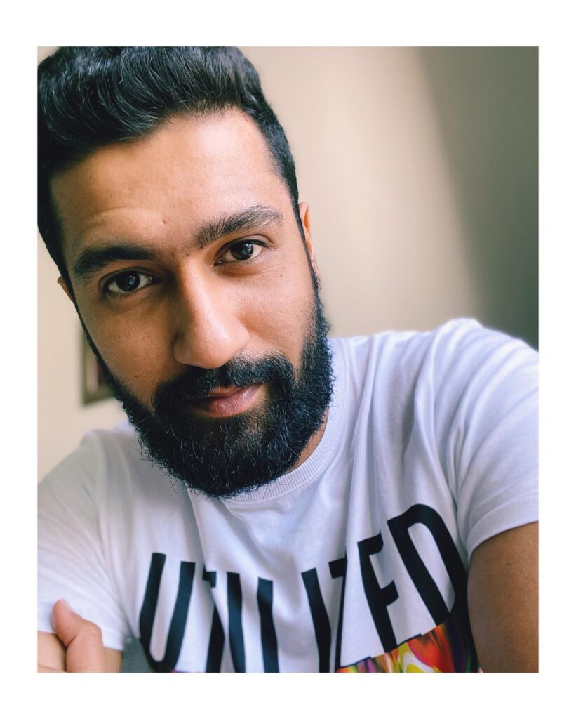 Vicky Kaushal in white t-shirt posing for a selfie - Indian actors without makeup