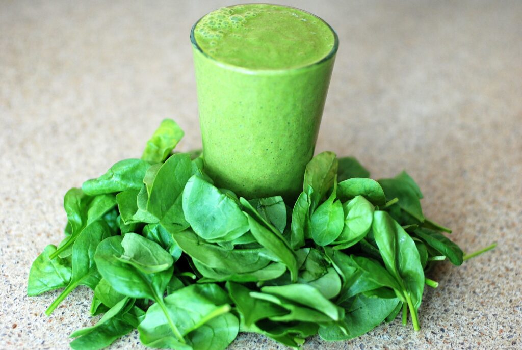 Day Green Smoothie serves in a glass with lots of spinach - vegetarian bodybuilders diet