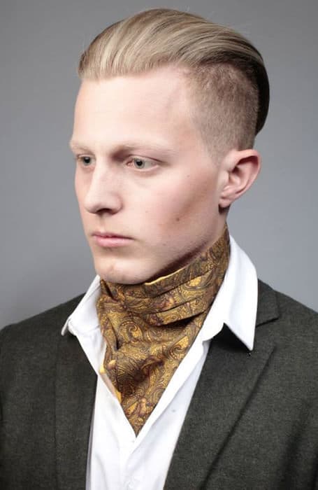 Man in grey coat with white shirt and mustard printed scarf showing his Disconnected Undercut - hair cut for men