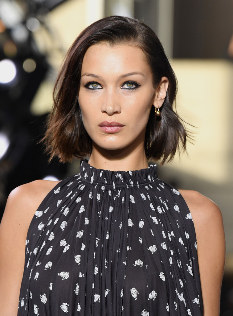 Bella Hadid on black and white high neck cut sleeves top showing her hairstyle - hollywood actresses short hair
