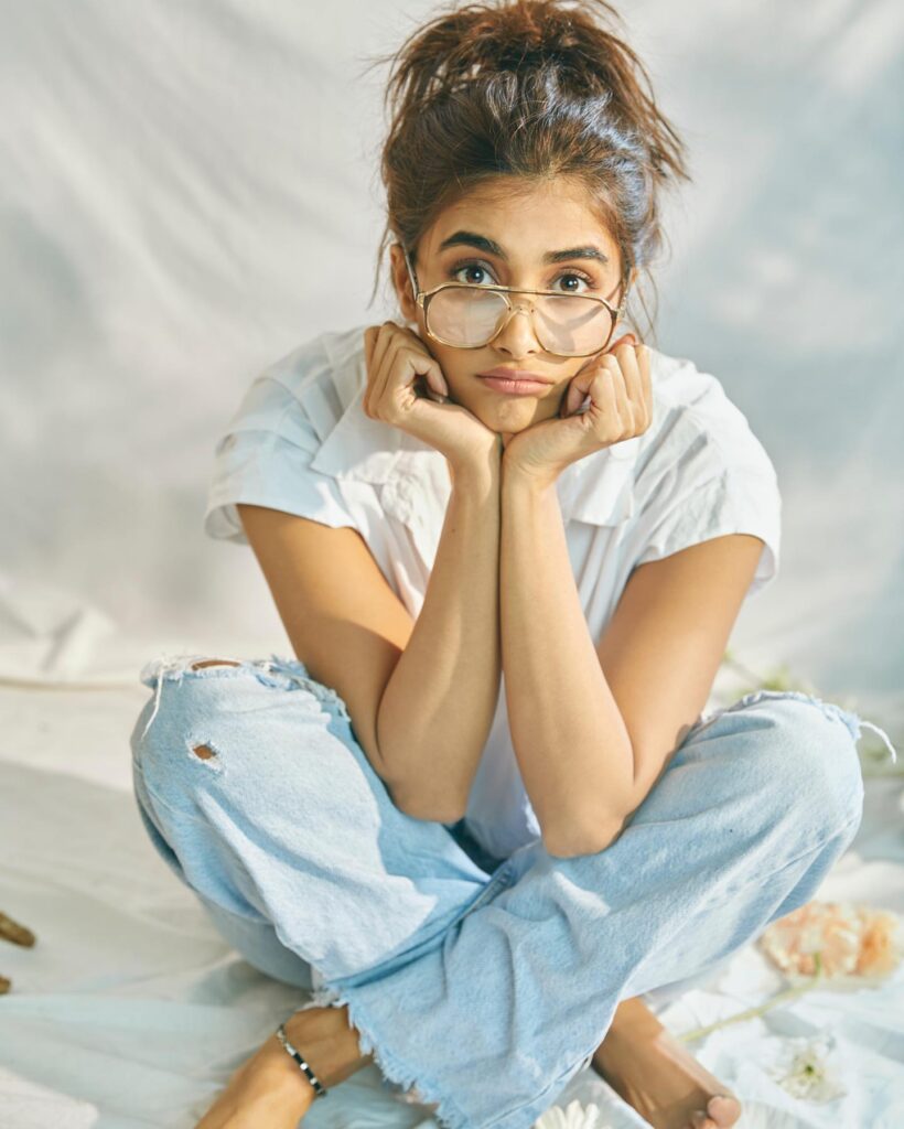 Pooja Hegde in white shirt blue jeans with spectacles posing for a no makeup look - south actress without makeup 