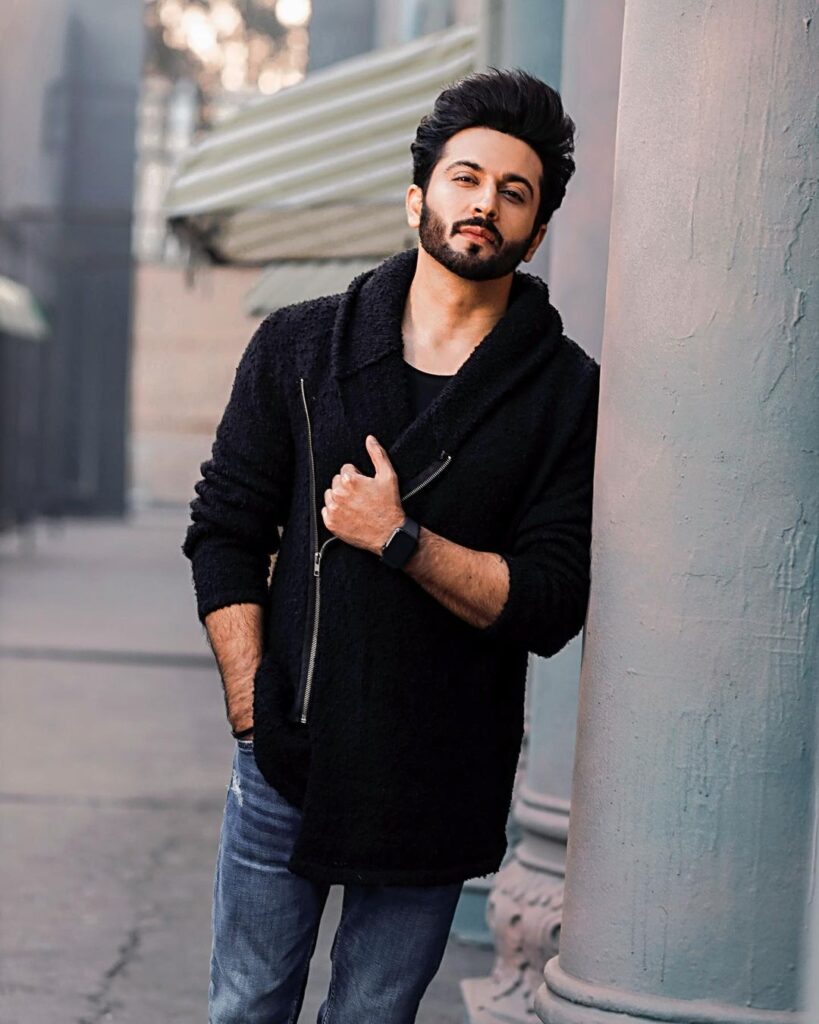 Dheeraj Dhoopar in black jacket with blue posing for camera - most handsome tv actor