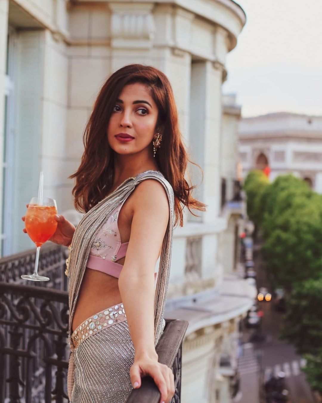 Barkha Singh in sequence saree and cut sleeves blouse posing for camera with a drink in her hand - beautiful indian girls